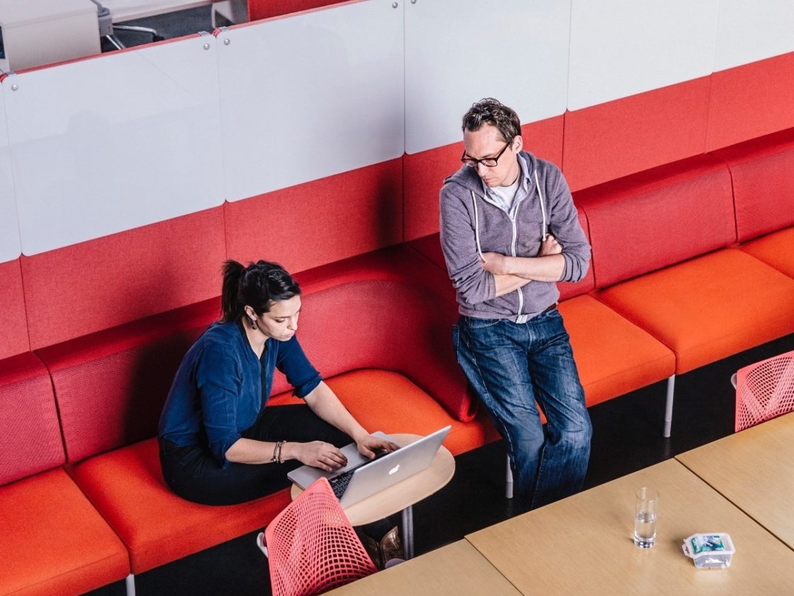 colleagues talking in office