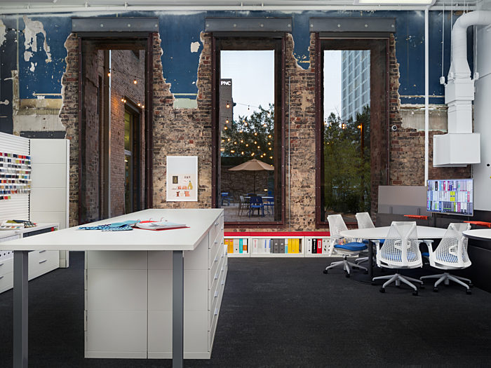 Creative office space design using custom office furniture and filing cabinets